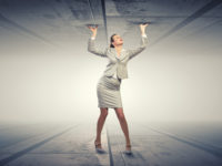 Woman in a suit propping up a ceiling